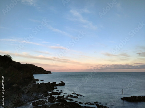 Pale sunrise. Combe Martin, North Devon