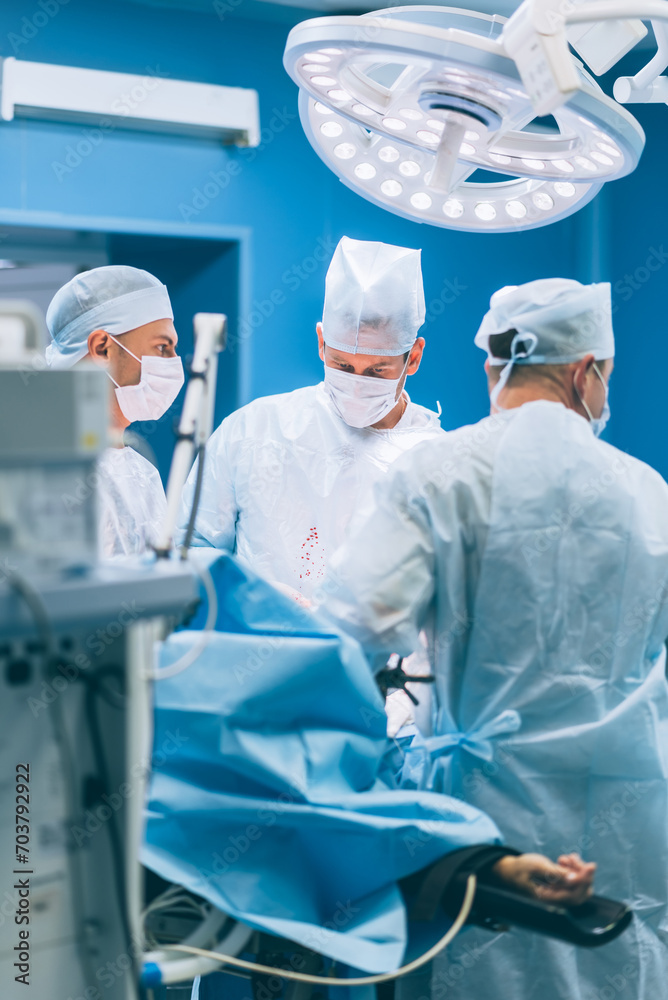 Doctors surgeons perform an operation in a hospital Doctors surgeons perform an operation in a hospital