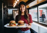 Woman in front of her small business food truck with holding burger