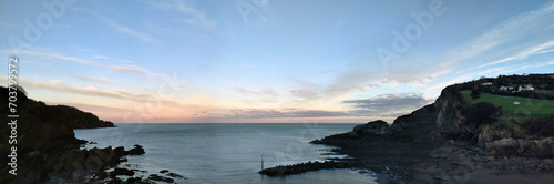 Pale sunrise. Combe Martin, North Devon