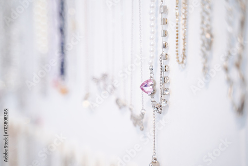 heart shaped jewelry necklace Fashion necklace hanging on a white wall