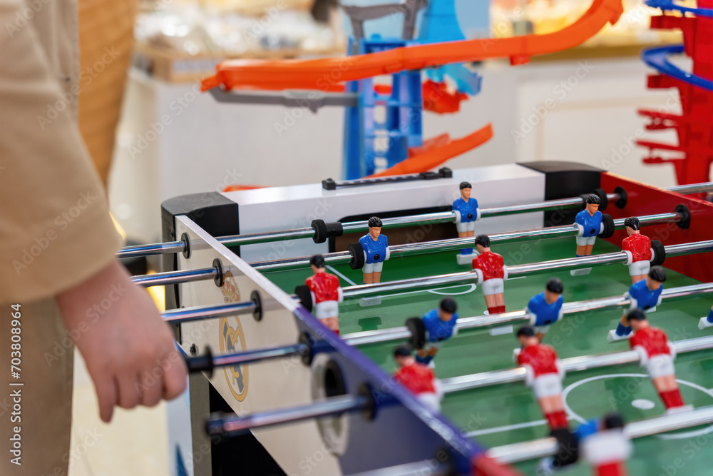 Naklejka premium Young people playing table football game