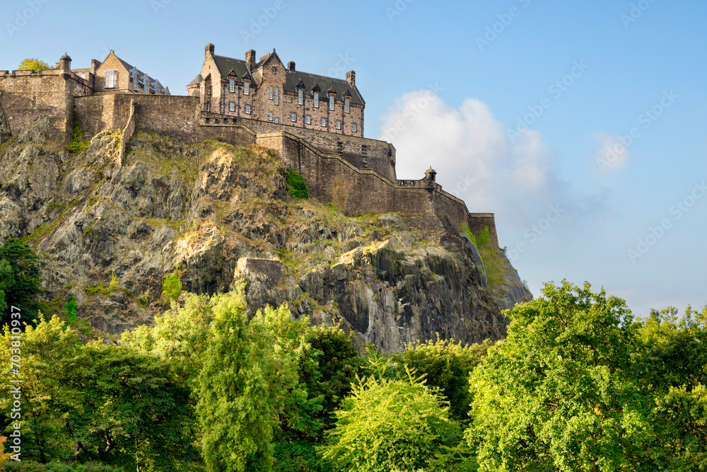 Edinburgh Castle, perched on its rock above the trees in Princes Street Gardens.