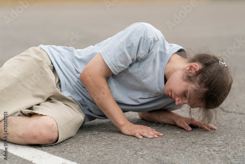 person walk in the street and fall down on the ground
