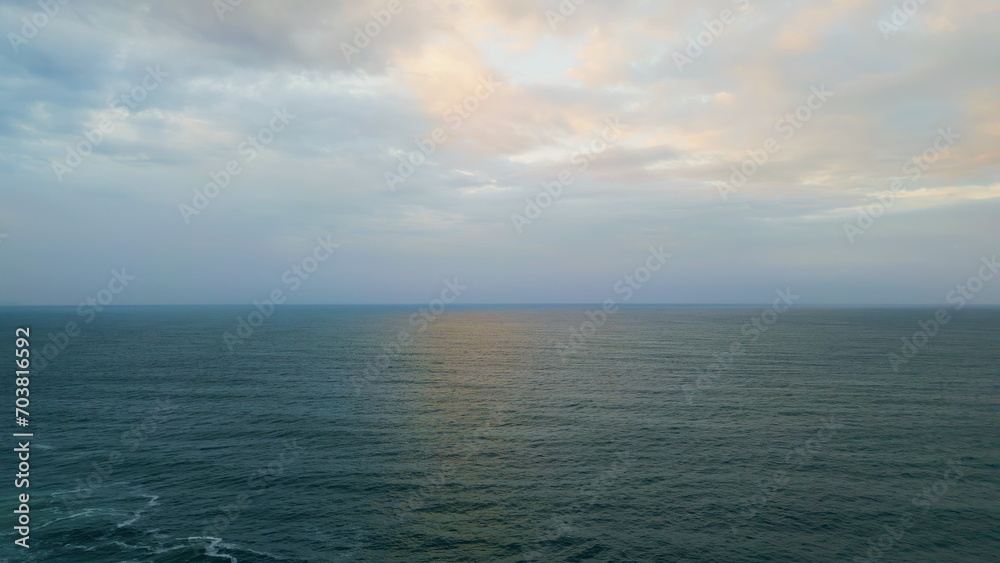 Panoramic cloudy marine landscape overcast weather. Aerial rays breaking clouds.
