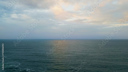 Panoramic cloudy marine landscape overcast weather. Aerial rays breaking clouds.