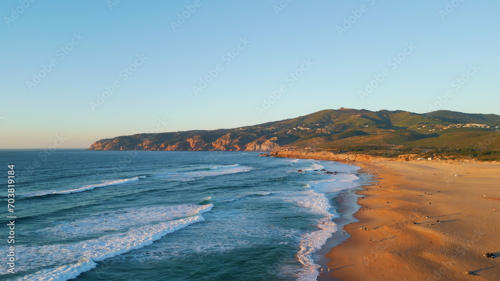 Panoramic marine landscape summer sunset. Aerial view foamy ocean waves rolling