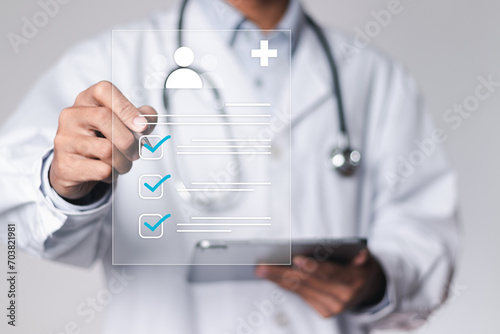 Obraz na płótnie Medicine doctor use tablet to review patient medical records on virtual screens for digital healthcare