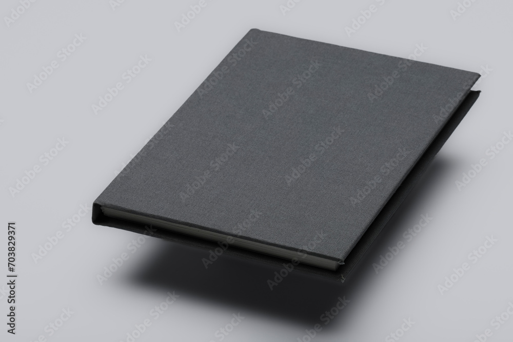 Blank hard cover floating book isolated on white background Blank hard cover floating book isolated on white background