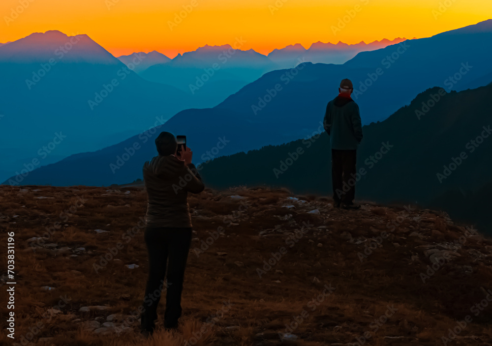 Alpine summer sunrise with hikers at Mount Sechszeiger, Jerzens, Imst, Tyrol, Austria