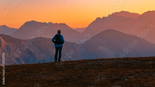 Alpine summer sunrise with a lonesome hiker at Mount Sechszeiger  Jerzens  Imst  Tyrol  Austria