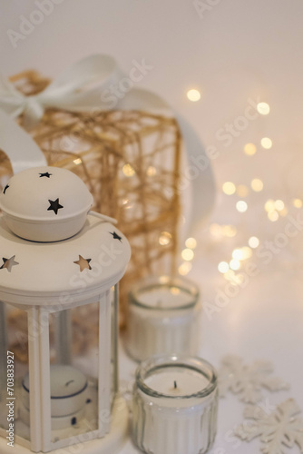 Christmas decoration with candles and snowflakes on a white background.