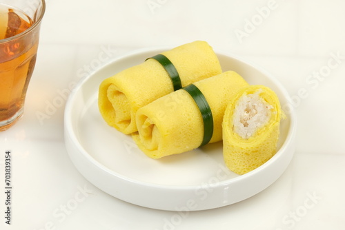 Semar Mendem, is a Javanese traditional snack made of glutinous rice, filled with shredded chicken, wrapped in crepes. photo