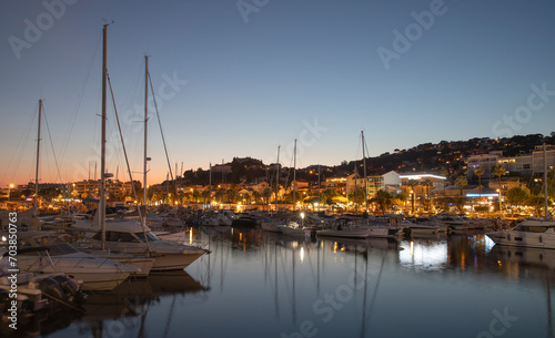 Port of Le Lavandou in the evening, France. Luxury yachts and motor boats. 