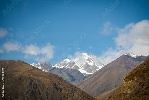 Mountain landscape with snow-capped peak