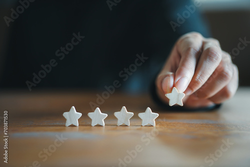 Customer Experience Concept. Man hand showing on five star excellent rating on background, copy space
