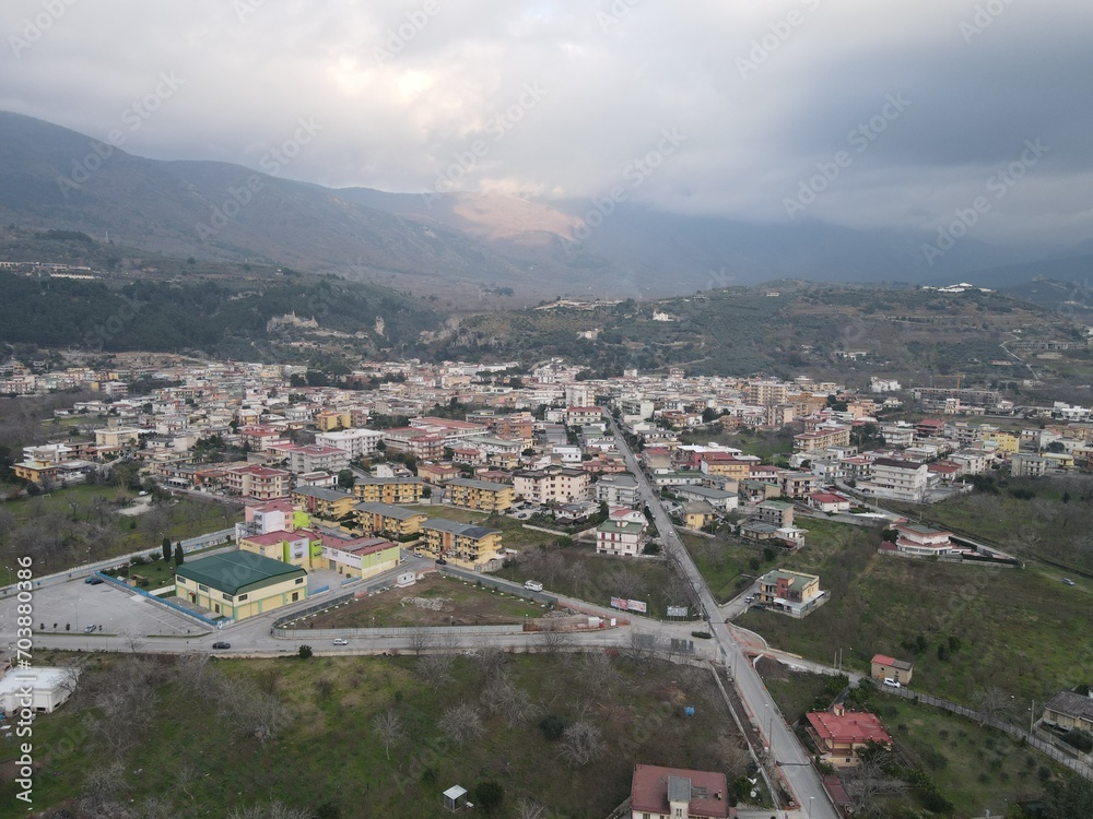 A panoramic view of a small town, nestled in the mountains, in southern Italy