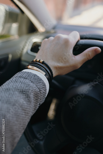 Leather bracelet on the male driver hand
