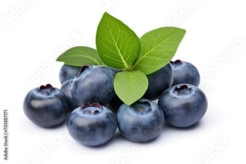 Fresh ripe blueberries with green leaves on a white background with shadow. Healthy organic blueberry, antioxidant