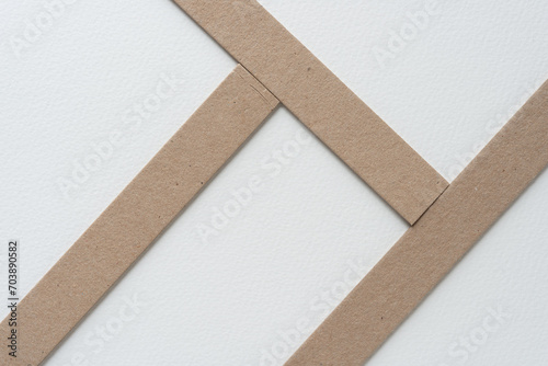 wide cardboard stripes arranged on blank paper