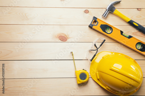 Work safety. Standard Construction site protective equipment on  top view wooden background, flat lay, copy space,safety first concepts.