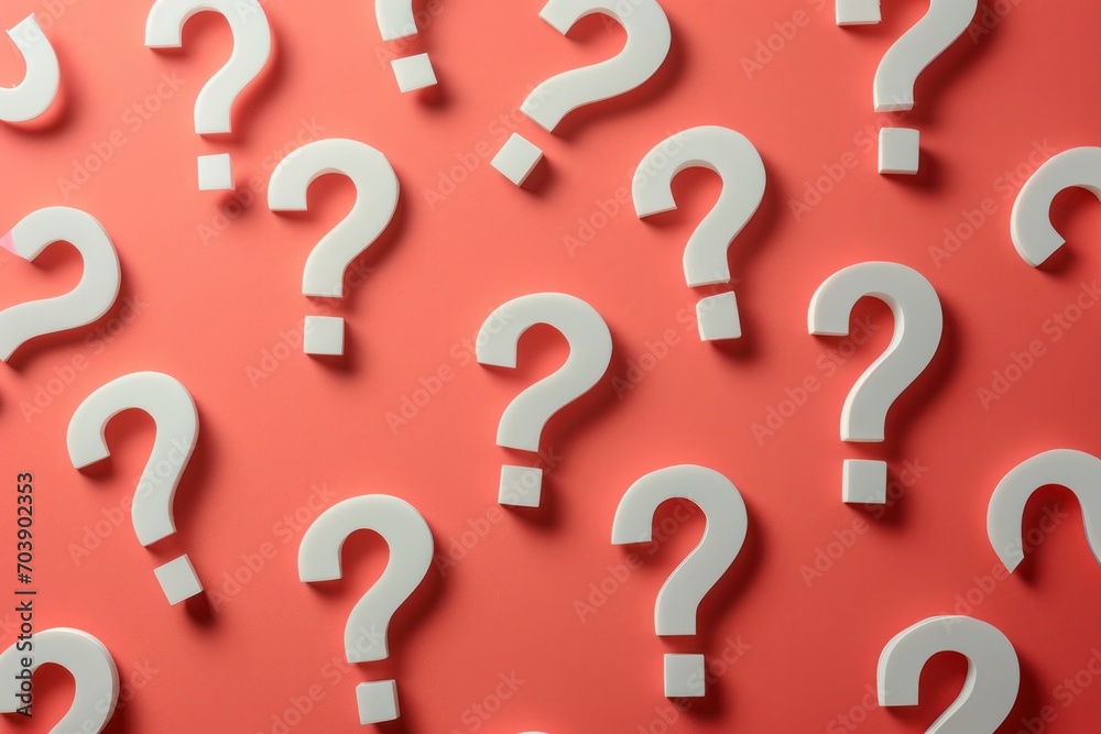 Bright red backdrop with white question marks, hemes of inquiry, uncertainty, and problem solving Bright red backdrop with white question marks, hemes of inquiry, uncertainty, and problem solving