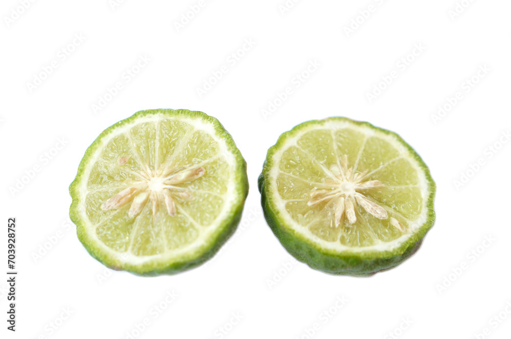 Half slice of bergamot fruit or Kaffir lime isolated on white background. Concept, herbal fruits with sour taste, can be cooked as food seasoning and use for spa , aroma. Medicinal herb. Half slice of bergamot fruit or Kaffir lime isolated on white background. Concept, herbal fruits with sour taste, can be cooked as food seasoning and use for spa , aroma. Medicinal herb.