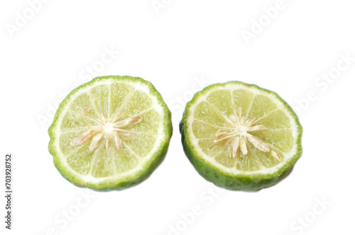 Fototapeta Naklejka Na Ścianę i Meble -  Half slice of bergamot fruit or Kaffir lime isolated on white background. Concept, herbal fruits with sour taste, can be cooked as food seasoning and use for spa , aroma. Medicinal herb.