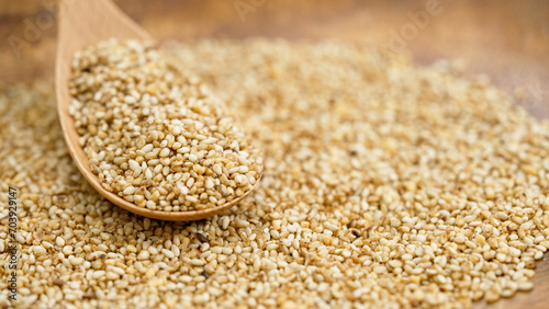 Close-up shot of garlic sesame seeds with wooden spoon, Selective focus