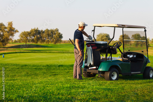 Athletic young man playing golf