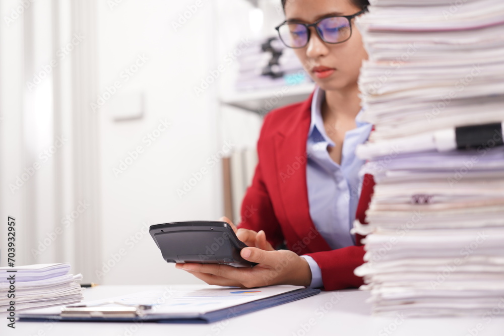 Asian and African office workers trying to feel bored, unhappy and bored working in the office. Business woman. Office worker working with pile of A4 papers. Happy working. Working. Asian and African office workers trying to feel bored, unhappy and bored working in the office. Business woman. Office worker working with pile of A4 papers. Happy working. Working.