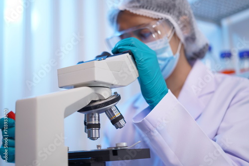 Science test tubes, laboratory equipment for new medical research, microbiology research with small pipettes in close-up. Asian and African female scientists in the laboratory, perfume samples