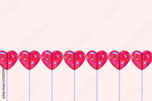 Fotografía Lollipop hearts on pastel pink background with copy space
