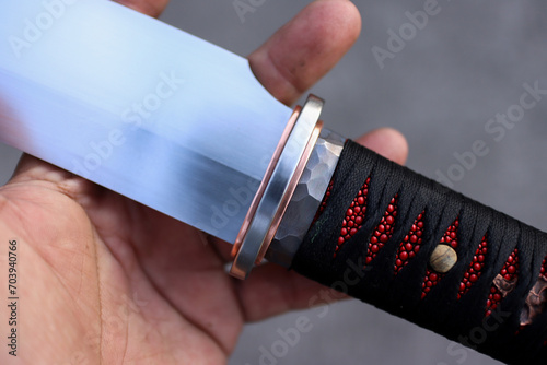 Red and black colure with tanto knife handle wraping photo
