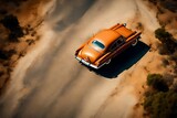 A top-down shot of a classic car on a scenic road, creating a nostalgic space for a vintage or retro-inspired message.