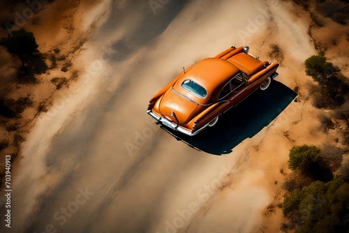 A top-down shot of a classic car on a scenic road  creating a nostalgic space for a vintage or retro-inspired message.