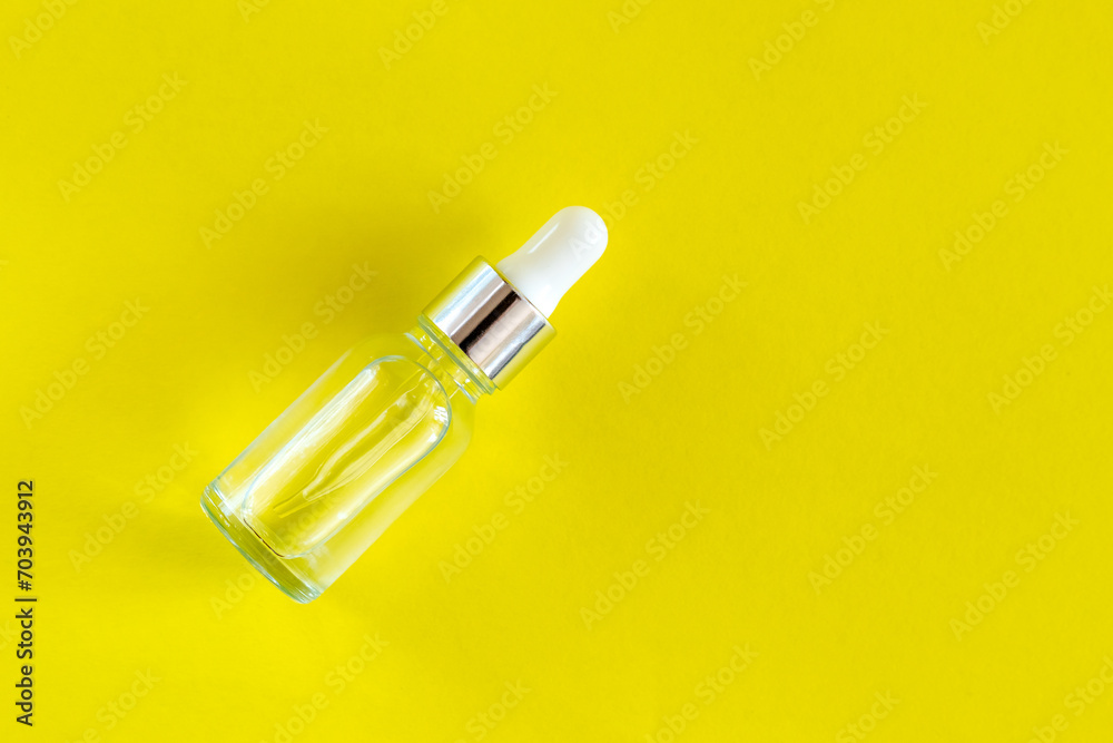 Natural medicine or aroma oil or beauty essence concept vial with dropper background. Face and body spa serum care concept Natural medicine or aroma oil or beauty essence concept vial with dropper background. Face and body spa serum care concept