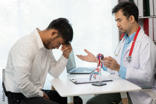 Doctor counseling of male patient with suspected bacterial prostatitis Prostate disease and treatment Anatomical model of the male reproductive system in the hands of a doctor.