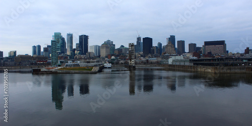 Cityscape of Montreal  Qc reflecting in the St Lawrence River