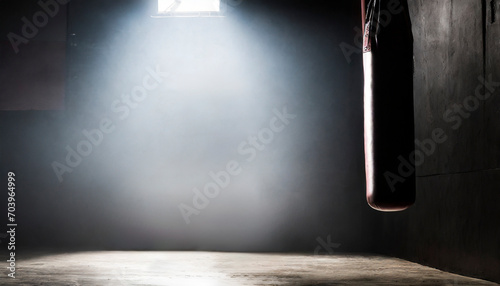 Close-up view of a punching bag in a dark room. photo