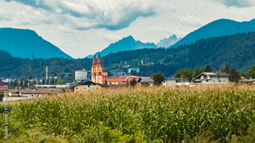 Alpine summer view with a church near Telfs, Innsbruck, Tyrol, Austria photo