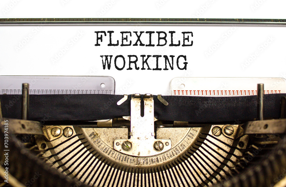 Flexible working symbol. Concept words Flexible working typed on beautiful old retro typewriter. Beautiful white paper background. Business flexible working concept. Copy space.