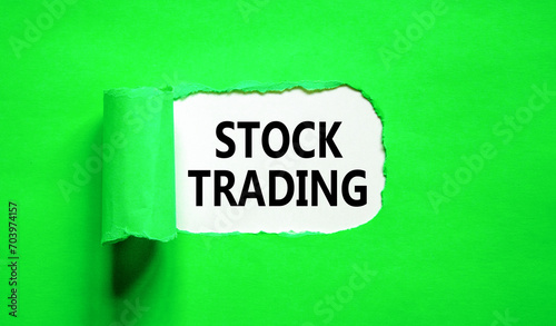 Stock trading symbol. Concept words Stock trading on beautiful white paper. Beautiful green paper background. Business stock trading concept. Copy space.