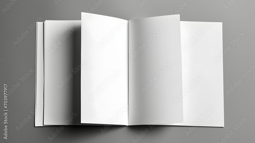 Open and closed blank brochures on grey background, top view. Mock up for design Open and closed blank brochures on grey background, top view. Mock up for design