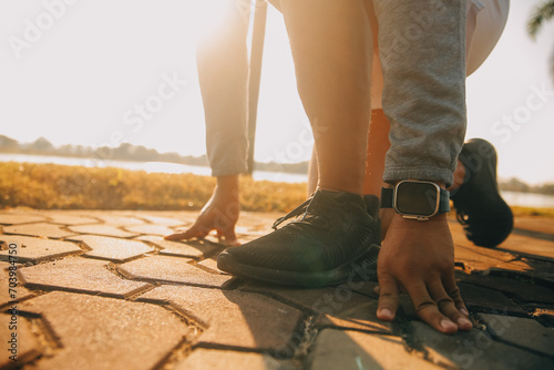 Athlete runner feet running on road, Jogging concept at outdoors. Man running for exercise..Athlete runner feet running on road, Jogging concept at outdoors. Man running for exercise.