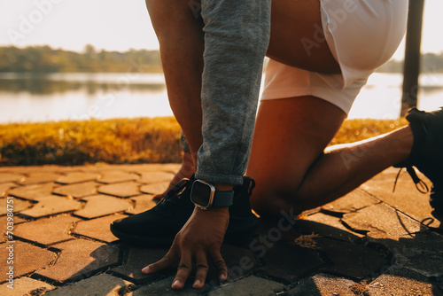 Athlete runner feet running on road  Jogging concept at outdoors. Man running for exercise..Athlete runner feet running on road  Jogging concept at outdoors. Man running for exercise.