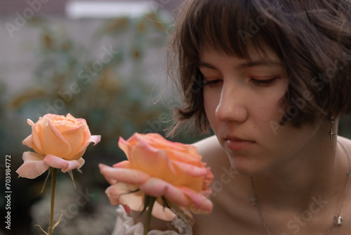 woman smelling a rose