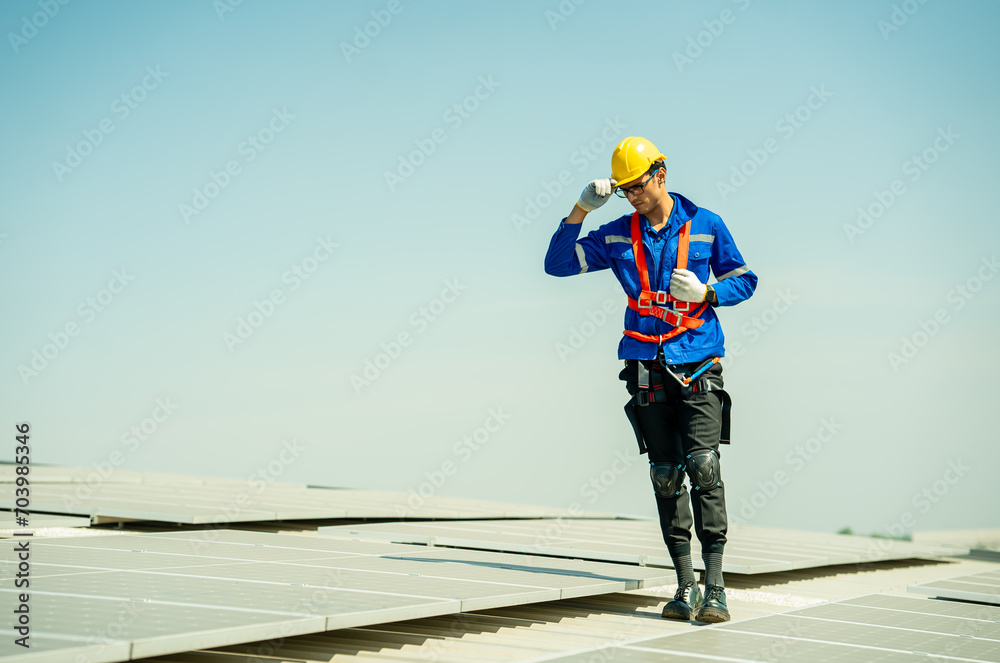 Specialist technician professional engineer checking top view of installing solar roof panel on the factory rooftop under sunlight. Engineers having service job of electrical renewable eco energy Specialist technician professional engineer checking top view of installing solar roof panel on the factory rooftop under sunlight. Engineers having service job of electrical renewable eco energy