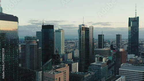 Aerial panorama of downtown glass skyscrapers. Cinematic drone shot morning cityscape skyline, high-rise modern architecture buildings, big city financial district, no logos and advertising billboards photo