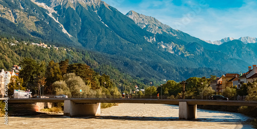 Alpine summer view with a bridge and the famous Nordkette mountains near Innsbruck, Tyrol, Austria